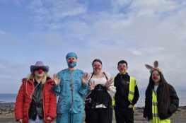 5 volunteers in costumes left to right, female cowgirl, female surgeon, female apothecary, male, female bunny